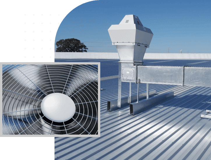 A fan on the roof of an industrial building.