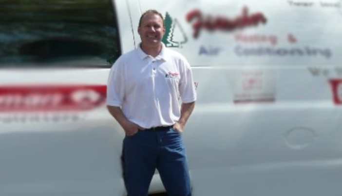 A man standing in front of a white van.